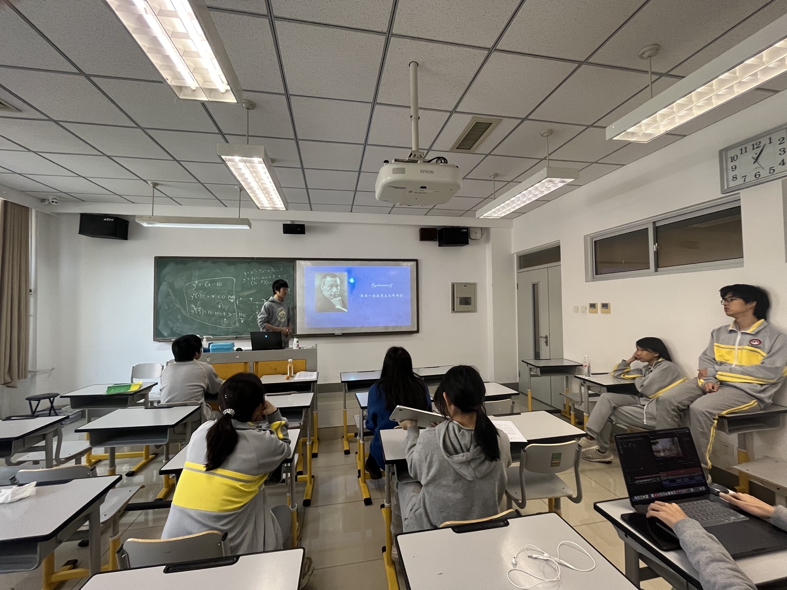 James presenting to classmates in a classroom music session.